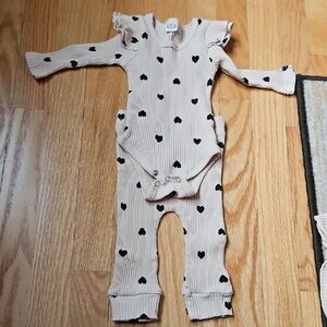 Cream Baby Romper with Black Hearts